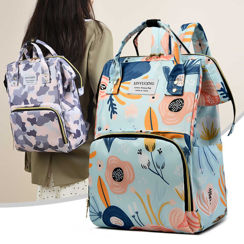 Novo estilo bolsa de mamãe bebê mãe com passeio de bebê moda mãe bebê mochila portátil grande capacidade leve bolsa mult