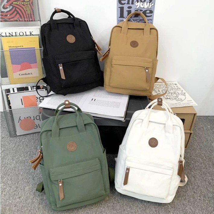 Mochila Escolar Casual de Lona Impermeável — Design Simples, Grande Capacidade e Estilo Versátil em Oferta na Shopee