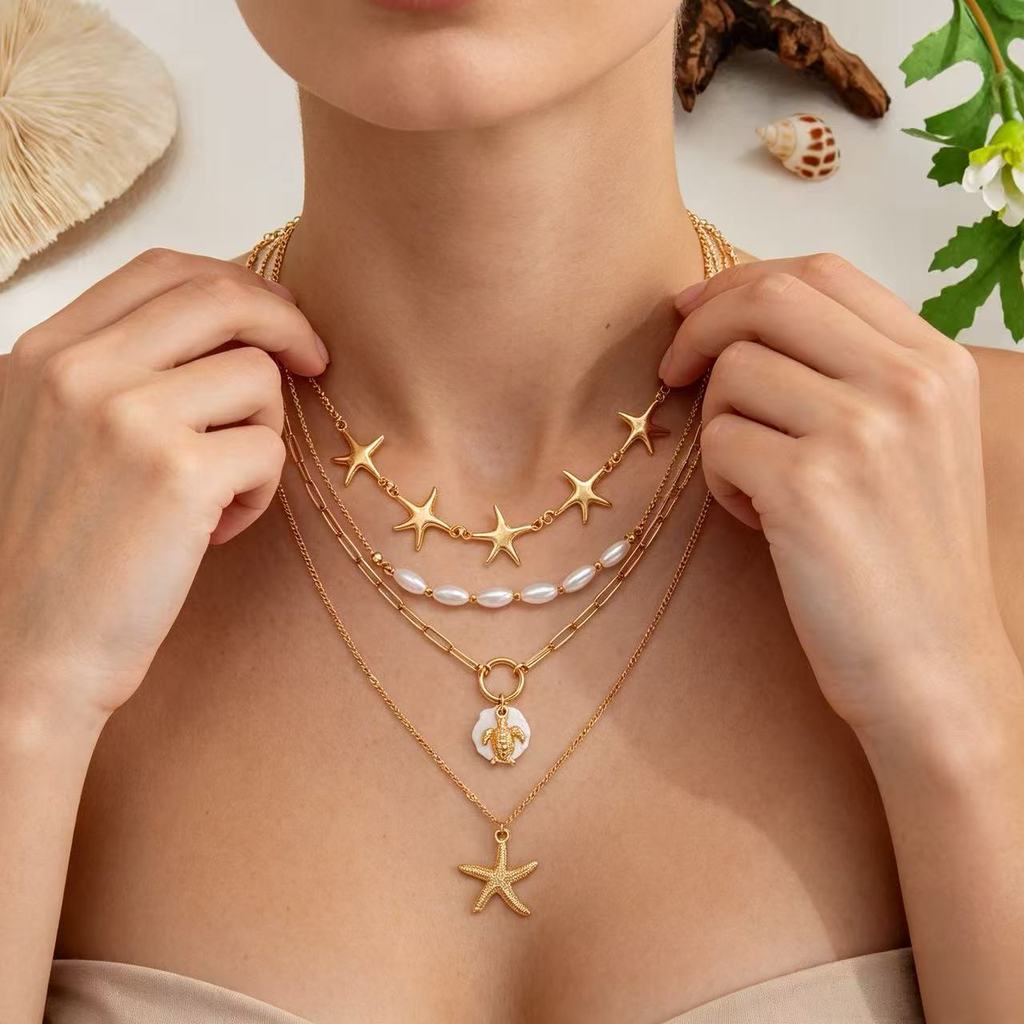 Colar de múltiplas fileiras, combinado com estrelas douradas e estrelas, pérolas elípticas e pingente de tartaruga