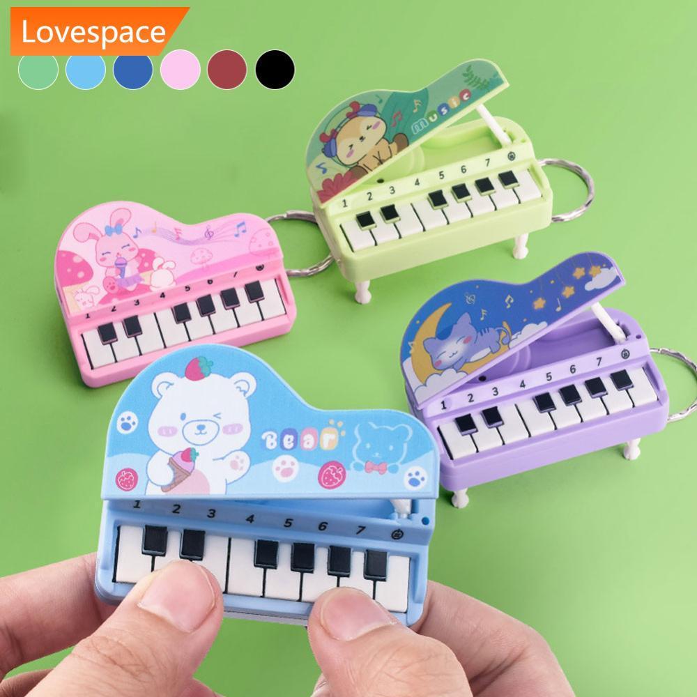 LS-STORE Mini Piano Eletrônico Com Treinamento De Luz Dedo Chaveiro Teclado Instrumento Musical Portátil Brinquedo P7R4
