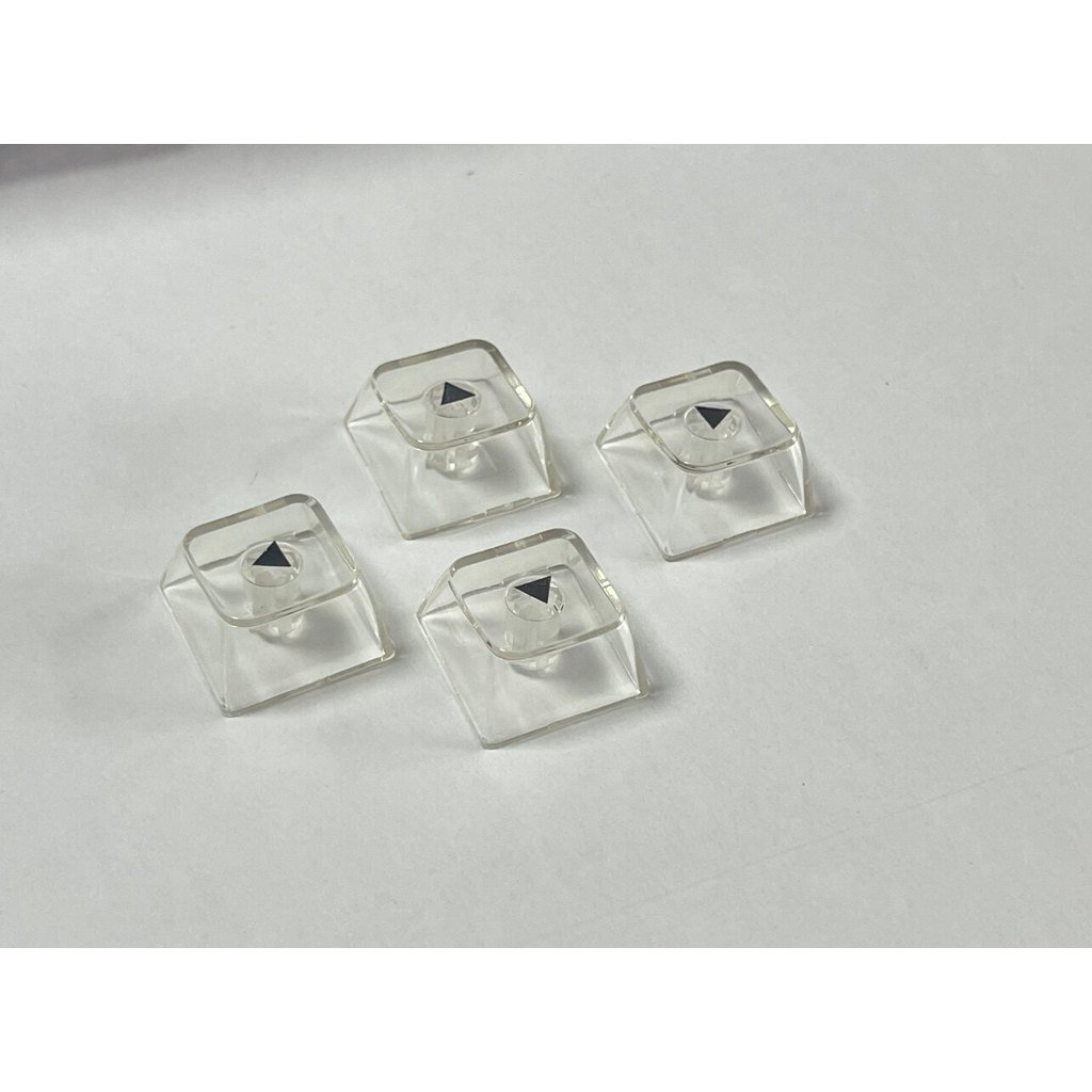 Um conjunto de teclas cinzas para teclas de seta, pretas, mecânicas, transparentes, redondas, quatro ILQJ.