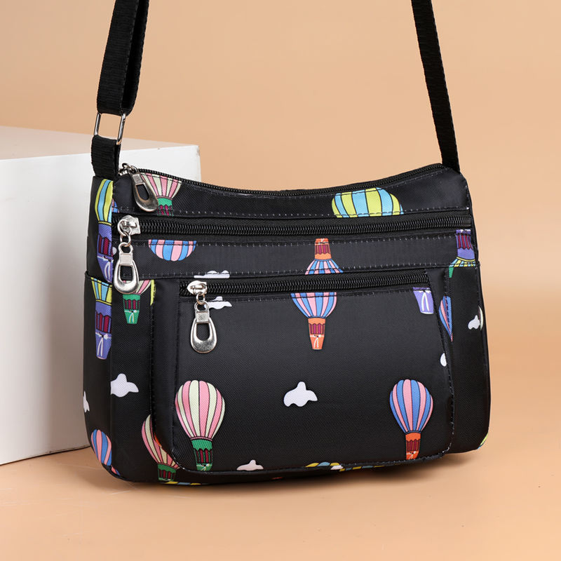 Bolsa mensageiro feminina pequena bolsa 2025 novo estilo versão coreana Oxford pano bolsa de lona Casual All-Match espor