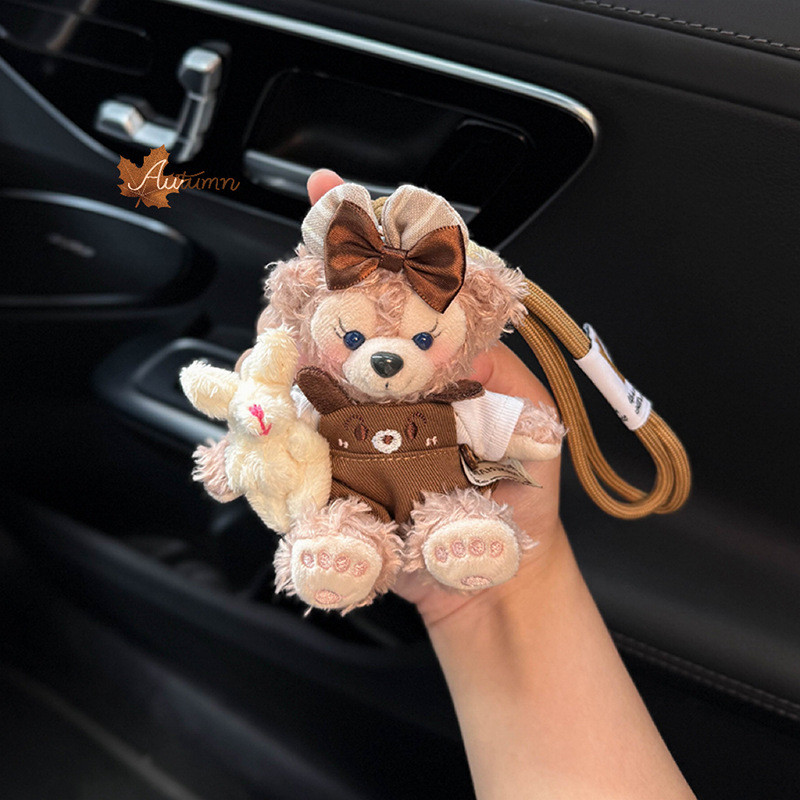 2026 novo estilo Duffy Shirley rosa saco pingente carro chaveiro pingente carro elétrico bonito boneca casal