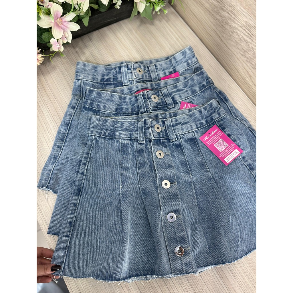 Saia Jeans Feminina Godê Plissada Colegial Com Diversos Botões Cintura Alta Lavagem Clara- Sem Elastano em Oferta na Shopee