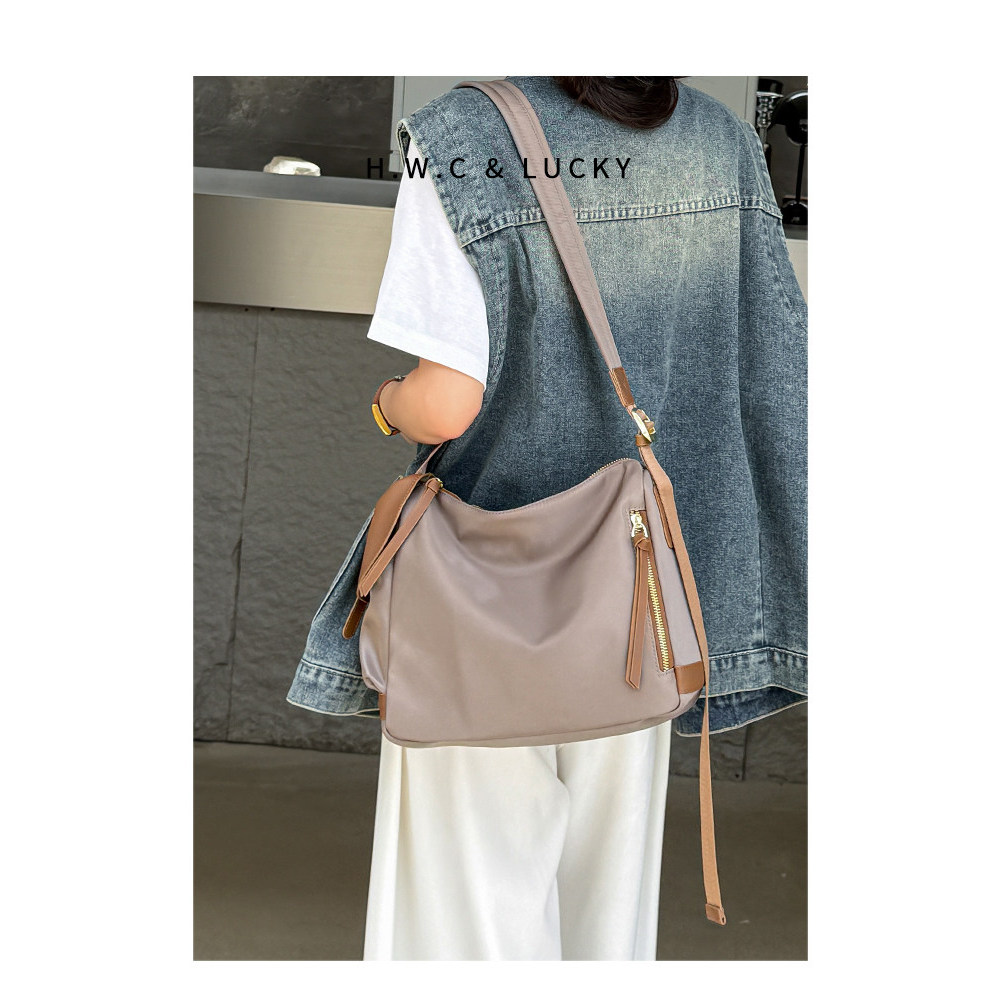 Bolsa feminina loja na segunda-feira 丨 bolsa feminina 2026 novo estilo bolsa mensageiro grande capacidade de lona