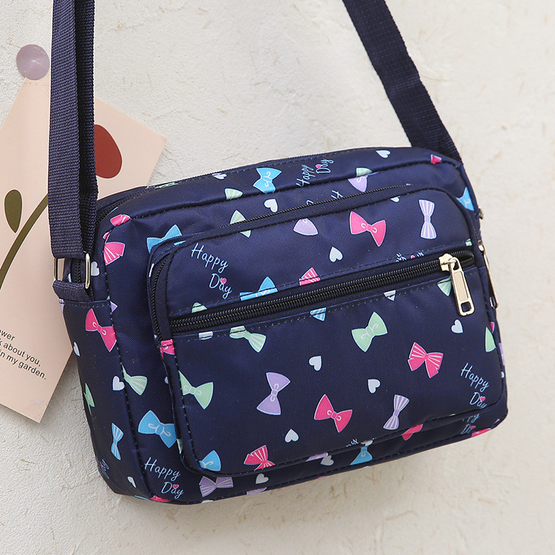 Bolsa mensageiro feminina pequena bolsa 2024 novo estilo versão coreana Oxford pano bolsa de lona Casual All-Match espor