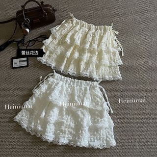 Leite damasco renda saia feminina 2025 primavera verão Design nicho cintura alta bola peluda saia de bolo fofo