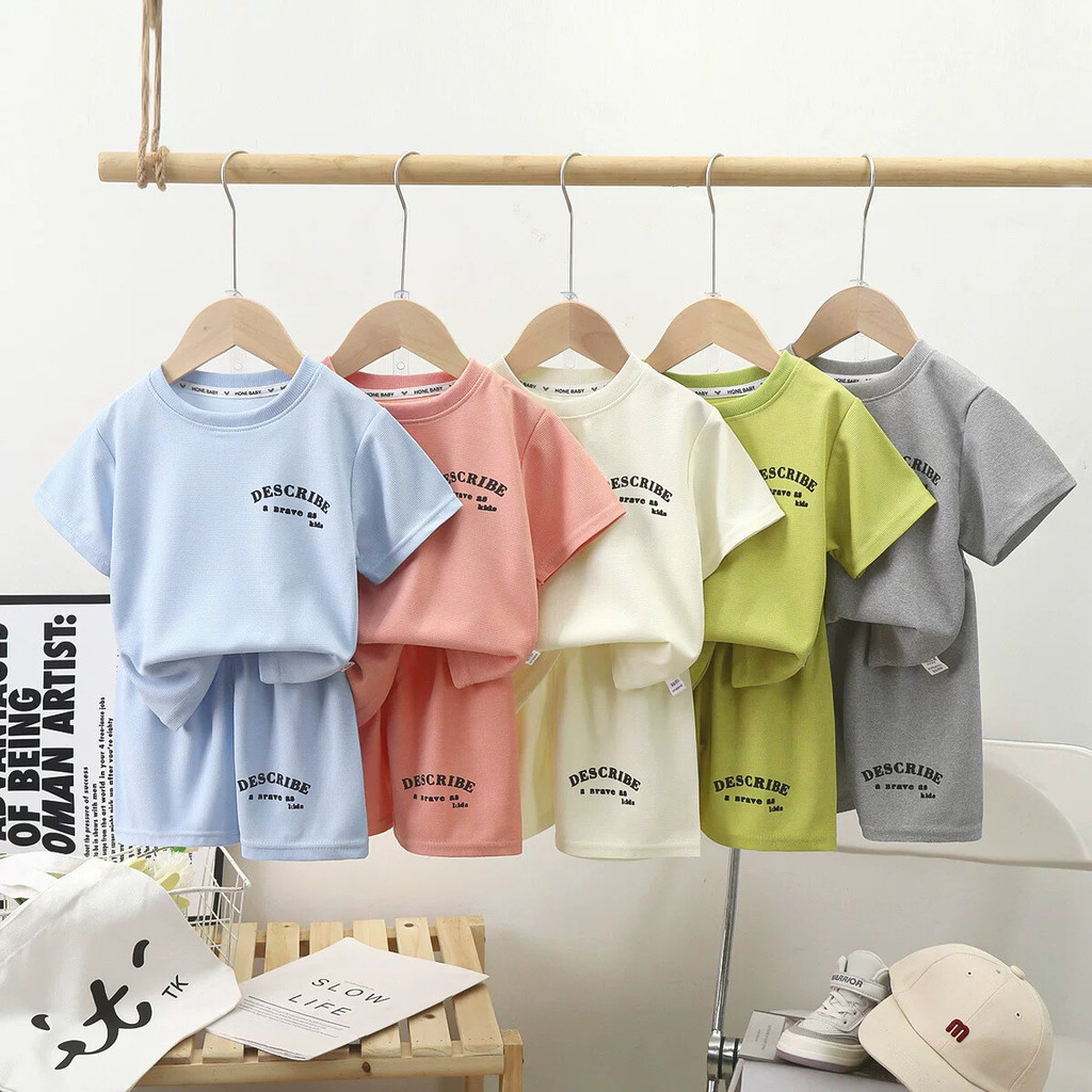 Crianças terno de manga curta 2026 verão versão coreana pequeno bebê bonito roupas meninos meninas camiseta Shorts terno
