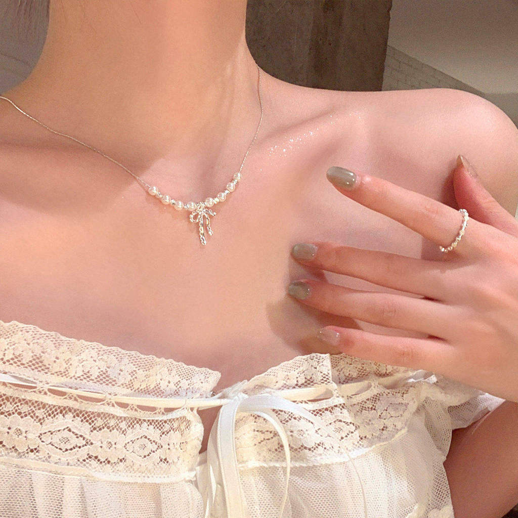 colar femenino colar Francês Bowknot acessório saia pérola colar feminino luz luxo nicho High-End elegante colar acessór