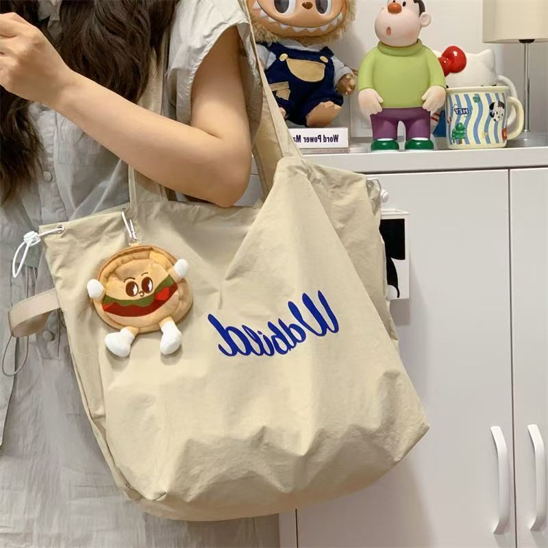 [Estoque pronto] Bolsa tote solta feminina novo estilo bolsa de lona com cordão bolsa de viagem leve de ombro de g