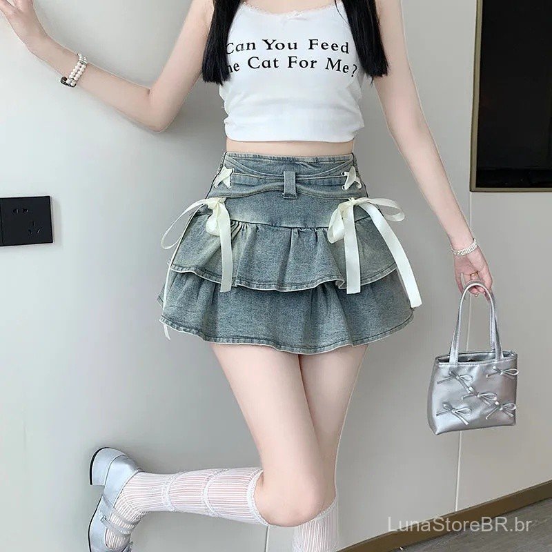 Saia plissada jeans azul para meninas, saia curta em A que afina a silhueta, saia com design moderno, saia-calça, saia r