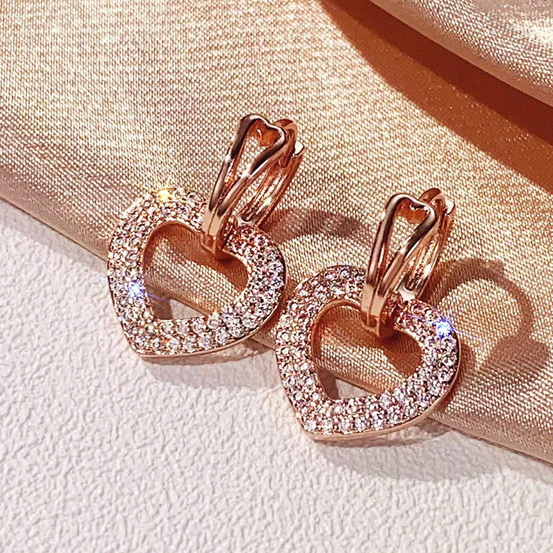 Belíssimos brincos em formato de coração em ouro rosado, adequados para mulheres, incrustados com zircônia brilhante, um