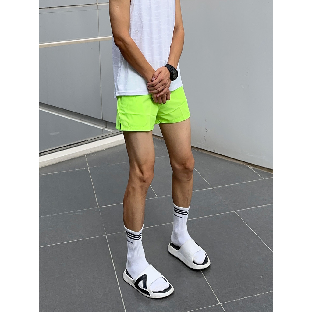 UNCLEBLUE esportes de secagem rápida masculino correndo lazer Fitness solto pista campo treinamento na altura do joelho 