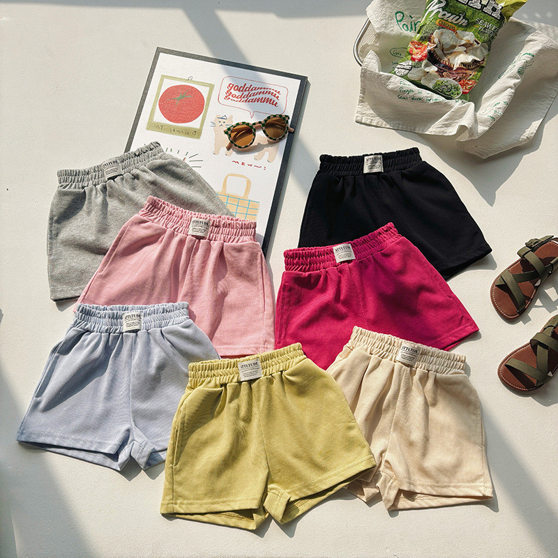 Crianças verão rotulagem calças médias 2025 novo estilo meninos meninas versão coreana Casual algodão Shorts soltos calç