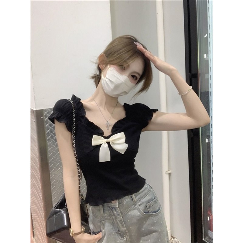 Estilo tribunal francês doce picante de um ombro manga Puff Bowknot camiseta feminina verão magro curto camisa pequena t