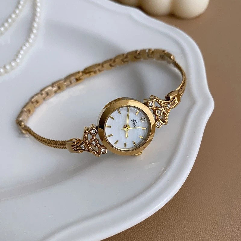 Relógio de pulso feminino GEDI, com bracelete de cristal dourado, design minimalista e elegante, relógio pequeno para mu