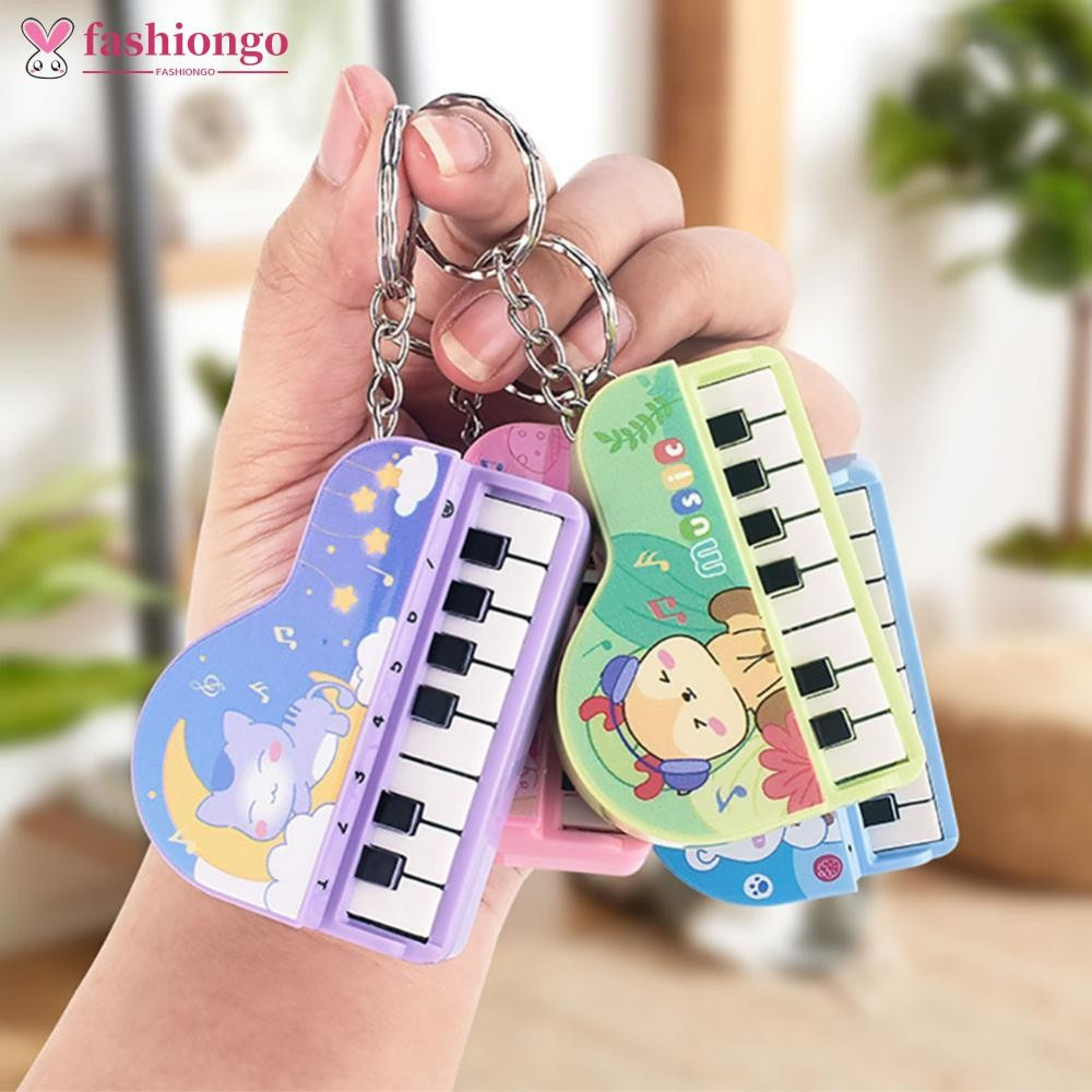 FASHIONGO Mini Piano Eletrônico Com Treinamento De Luz Dedo Chaveiro Teclado Portátil Instrumento Musical Brinquedo L9S1