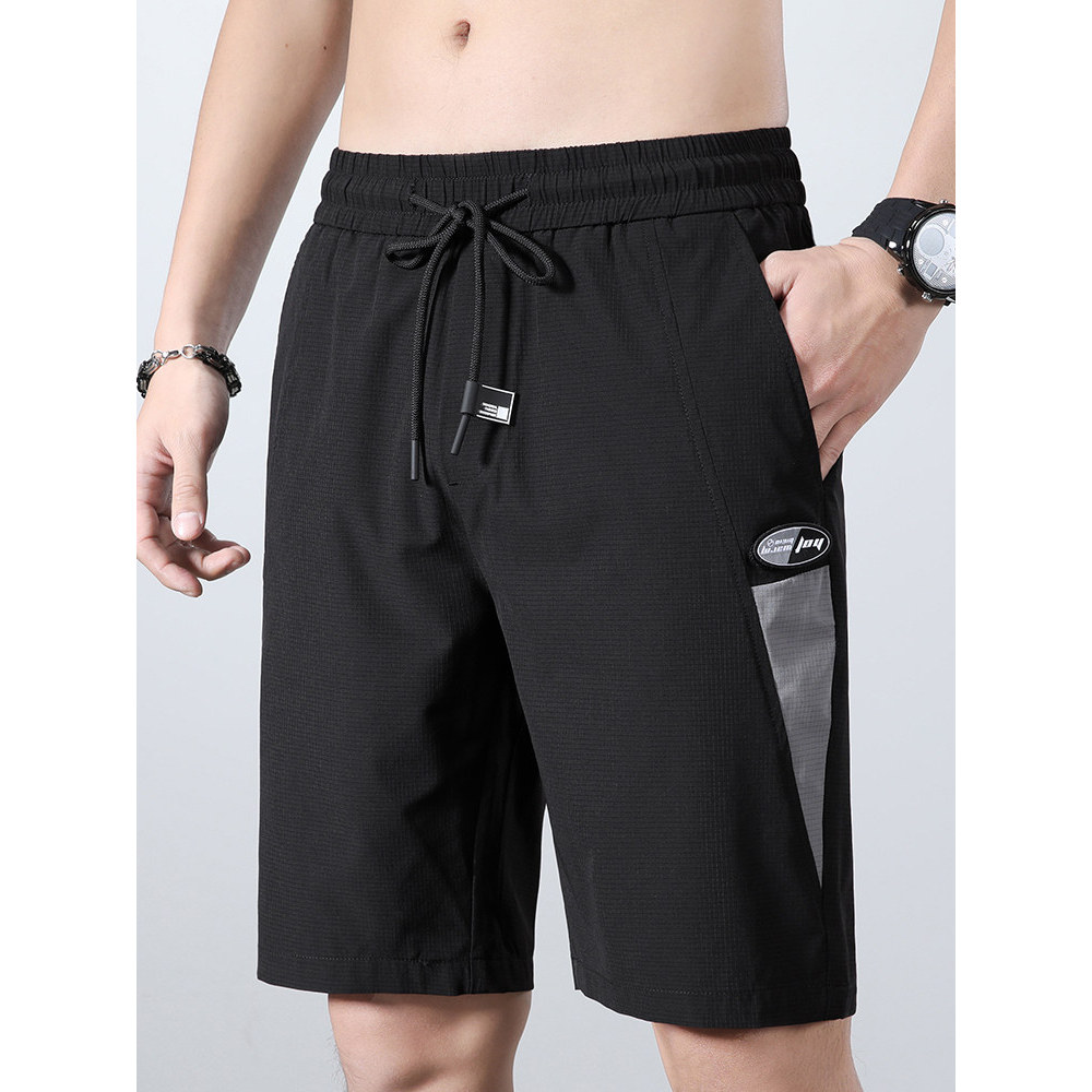 Verão fino gelo seda Shorts masculino verão solto cinco pontos calças médias calças de praia calças na moda exterior Wea
