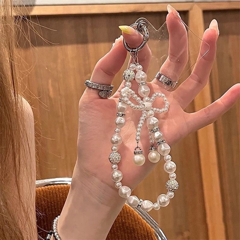 Novo estilo diamante-cravejado pérola arco corrente cordão do telefone móvel corrente de mão chaveiro câmera fone de ouv