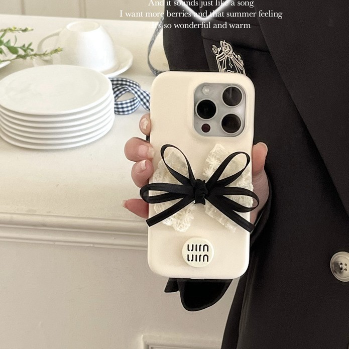 Adequado para 16 mãos do chassi couro Anti-fragrância simples arco-nó choque pequeno Apple 15promaxiphone1413