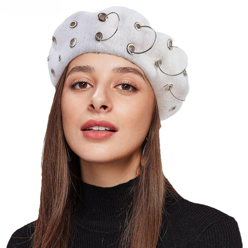 Este gorro, com um anel metálico de cor sólida, é um gorro de malha grosso e folgado, ideal para manter o calor no inver