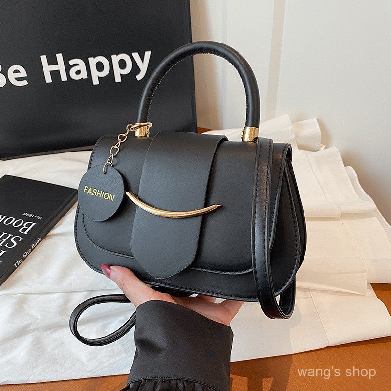 Bolsa pequena quadrada versátil com design moderno e exclusivo para mulheres 2024, elegante, de cor sólida, inspirada na