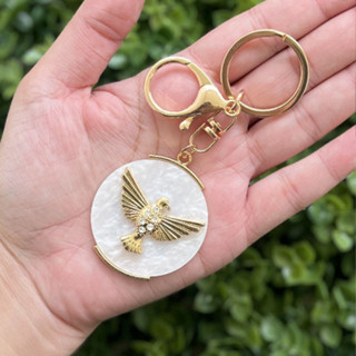 12 Chaveiros Religioso Divino Dourado com Madre Pérola - Com 12 unid. em Oferta na Shopee