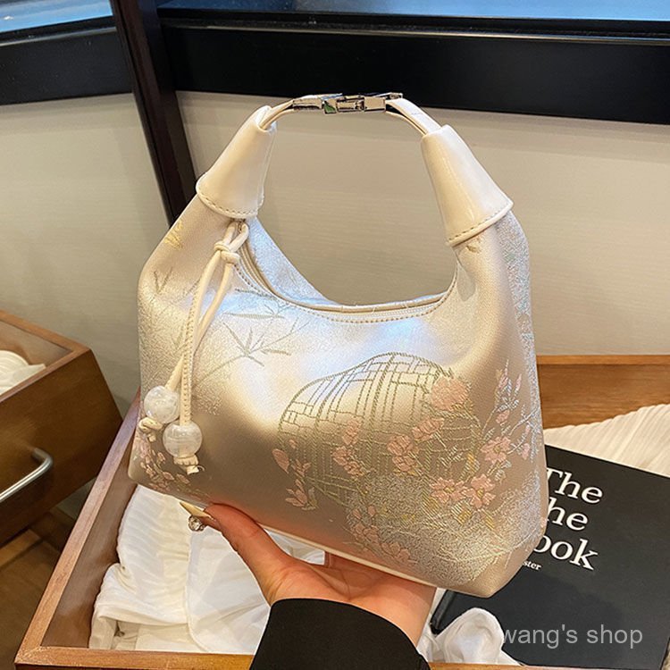 Bolsa feminina nova de estilo chinês, moderna e bordada, bolsa de ombro simples e sofisticada de nicho.