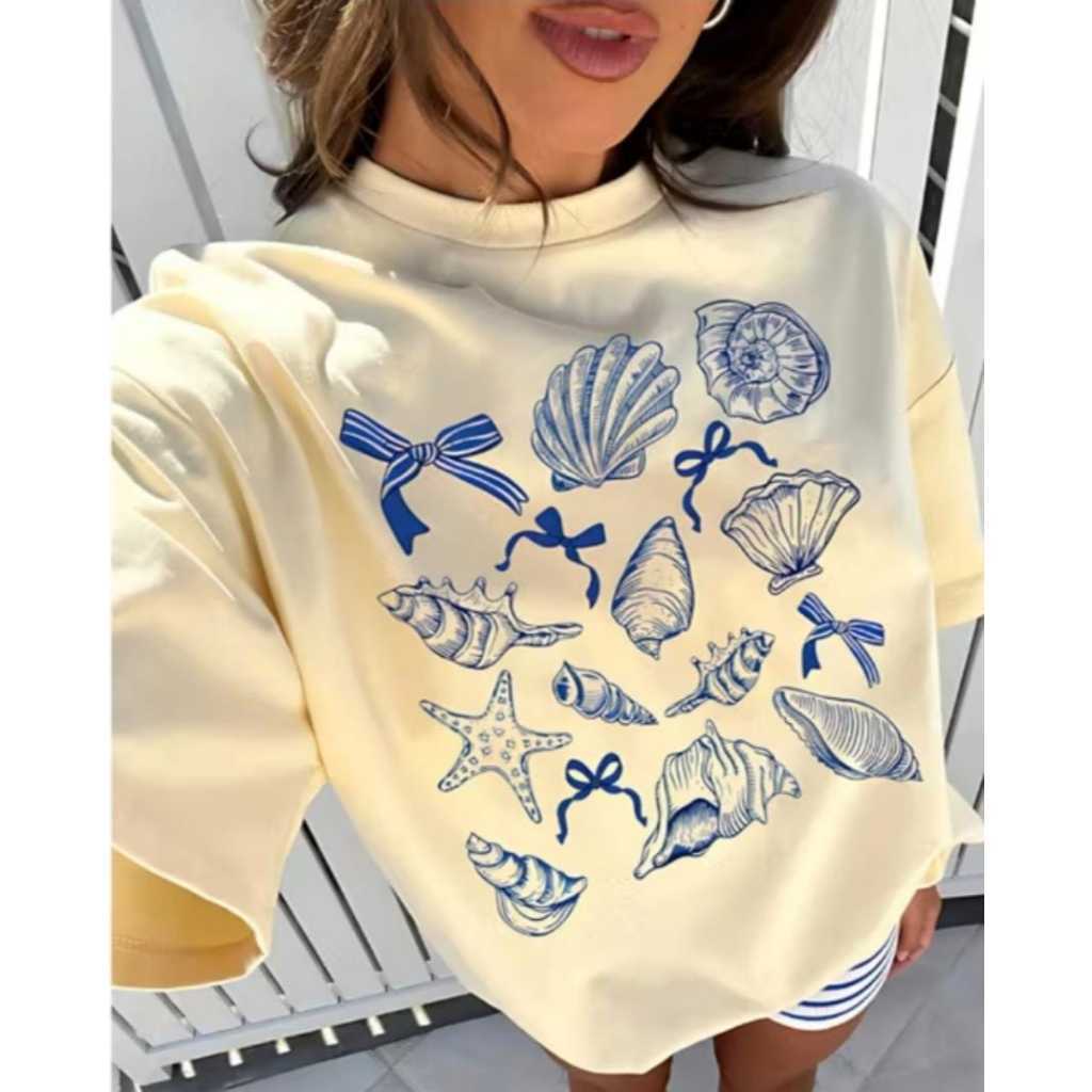 Camiseta Oversized Feminina de Verão Estampa Concha Marinha e Laço 100% Algodão Premium