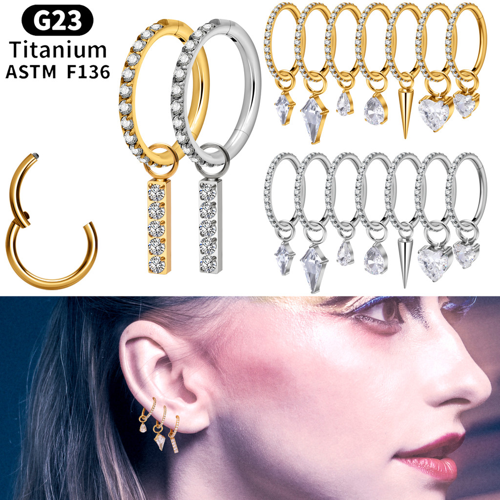 É um piercing de nariz e um pingente de brinco, uma joia de titânio banhada a ouro e cravejada de diamantes.