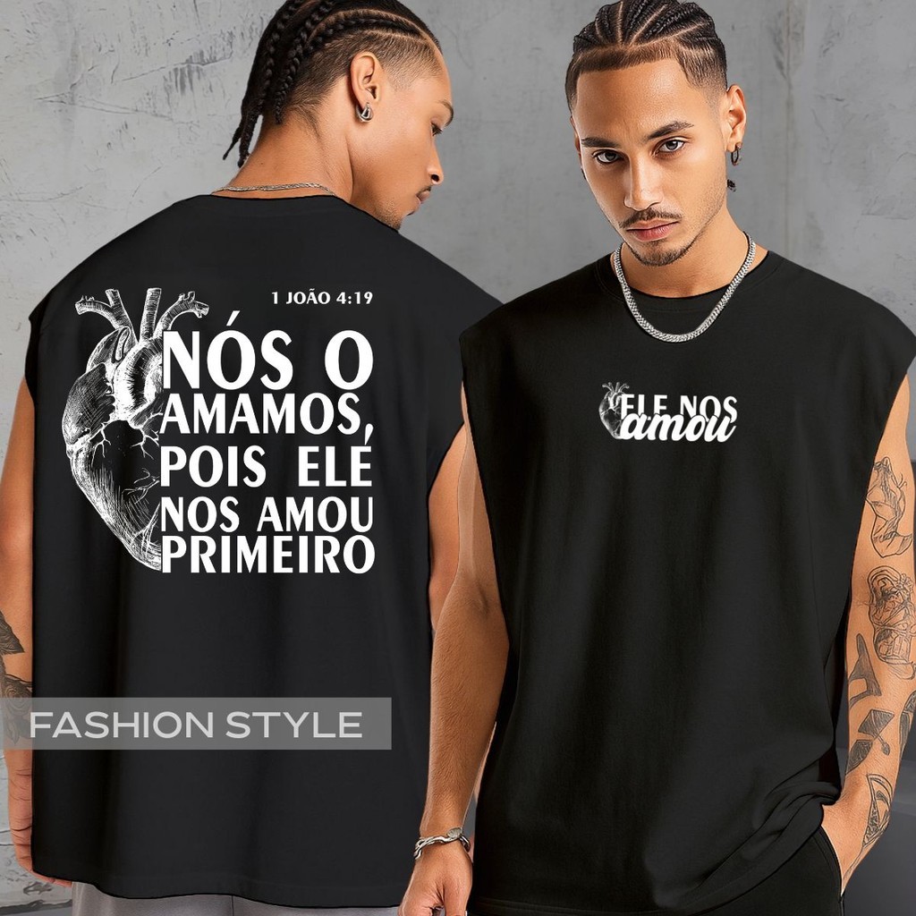 Regata Oversized Religiosa Ele Nos Amou Jesus Deus 1 João 4:19 Versículo Coração Regata Machão Blusa Cavada