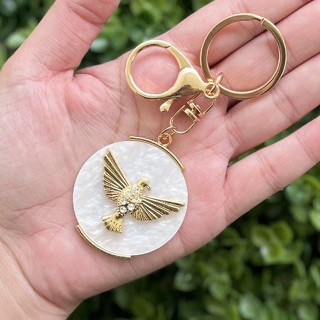 12 Chaveiros Religioso Divino Dourado com Madre Pérola - 12 unidades em Oferta na Shopee