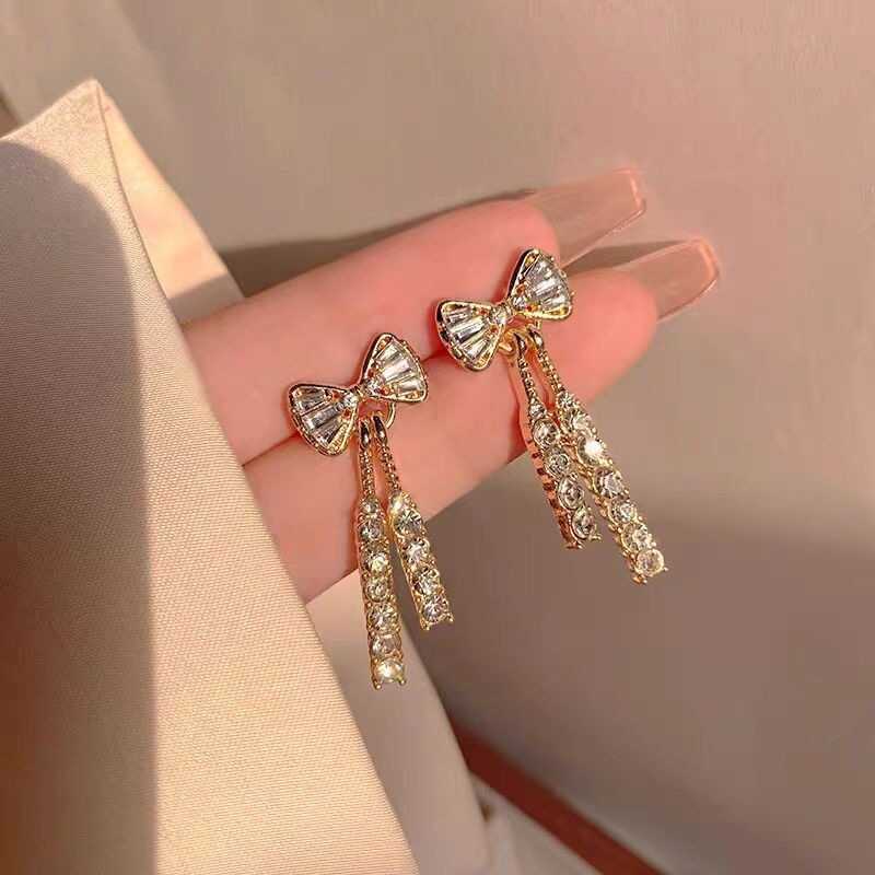 Arco diamante cristal borla brincos feminino moda temperamento novo estilo na moda brincos Design luz luxo doce brincos